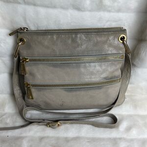 Hobo Mission leather light gray crossbody bag with bold gold tone hardwares